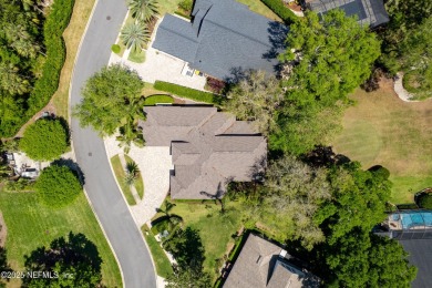 Nestled beneath a canopy of mature oak trees in the gated on Queens Harbour Yacht and Country Club in Florida - for sale on GolfHomes.com, golf home, golf lot