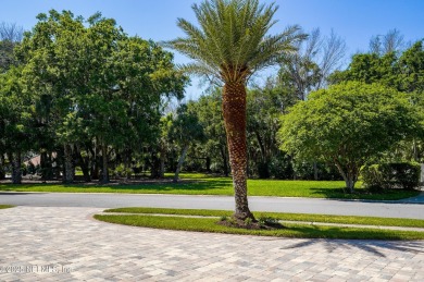 Nestled beneath a canopy of mature oak trees in the gated on Queens Harbour Yacht and Country Club in Florida - for sale on GolfHomes.com, golf home, golf lot