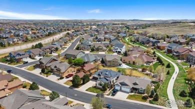 This two-story gem is a total showstopper! Located in the on Pelican Lakes Golf and Country Club in Colorado - for sale on GolfHomes.com, golf home, golf lot
