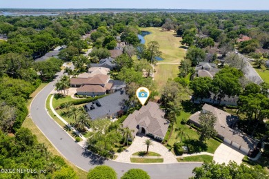 Nestled beneath a canopy of mature oak trees in the gated on Queens Harbour Yacht and Country Club in Florida - for sale on GolfHomes.com, golf home, golf lot
