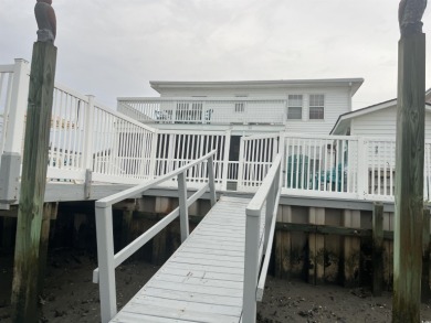 This Charming Multi Family 5 Bedroom,5 bath home nestled on the on Tidewater Golf Club and Plantation in South Carolina - for sale on GolfHomes.com, golf home, golf lot