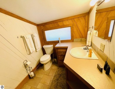 Stylish & spacious contemporary home overlooking popular Summit on Shanty Creek Golf Course in Michigan - for sale on GolfHomes.com, golf home, golf lot