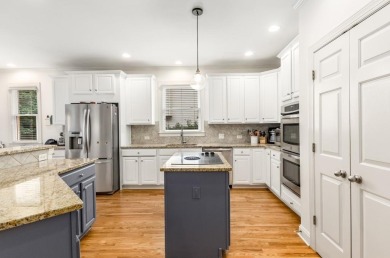 Come home to this beautifully maintained three-sided brick on The Golf Club of Georgia in Georgia - for sale on GolfHomes.com, golf home, golf lot