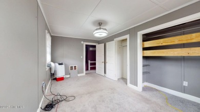 Enjoy quality time with loved ones in the spacious den, or host on Plymouth Country Club in North Carolina - for sale on GolfHomes.com, golf home, golf lot