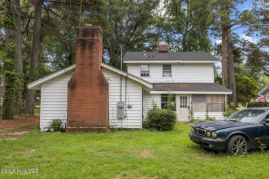 Enjoy quality time with loved ones in the spacious den, or host on Plymouth Country Club in North Carolina - for sale on GolfHomes.com, golf home, golf lot