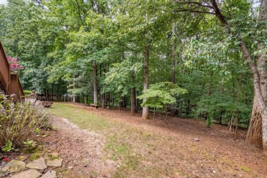 Come home to this beautifully maintained three-sided brick on The Golf Club of Georgia in Georgia - for sale on GolfHomes.com, golf home, golf lot