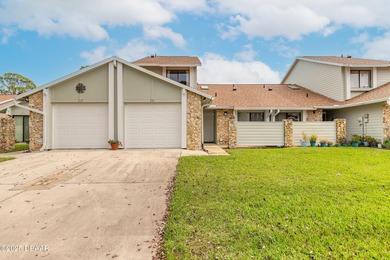 Welcome to this inviting 3-bedroom, 2.5-bathroom townhome on The Club At Pelican Bay - North Course in Florida - for sale on GolfHomes.com, golf home, golf lot