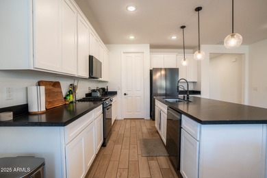 LOWEST-PRICED HOME IN THE AREA! Discover elevated desert living on Verrado Golf Club  in Arizona - for sale on GolfHomes.com, golf home, golf lot