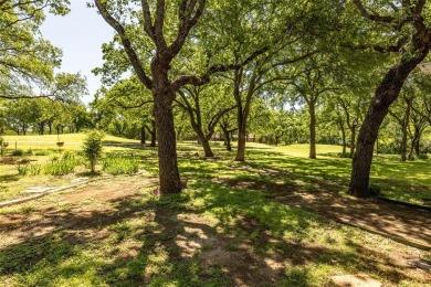 Exquisite home sits on double lot adjacent to golf course. Entry on The Club At Runaway Bay in Texas - for sale on GolfHomes.com, golf home, golf lot