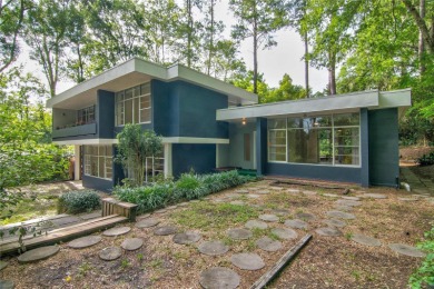 Impressive 6-bedroom 3-bathroom Mid-Century Modern concrete on Mark Bostick Golf Course At University of Florida in Florida - for sale on GolfHomes.com, golf home, golf lot