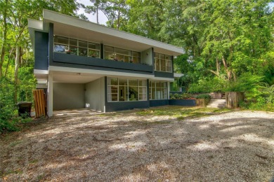 Impressive 6-bedroom 3-bathroom Mid-Century Modern concrete on Mark Bostick Golf Course At University of Florida in Florida - for sale on GolfHomes.com, golf home, golf lot