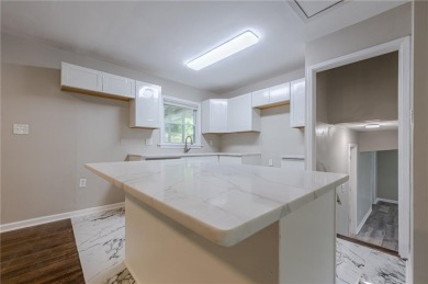 This home qualifies for up to $15,000 in grants--no income on Browns Mill Golf Course in Georgia - for sale on GolfHomes.com, golf home, golf lot