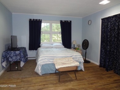 LARGE LAKE WALLENPAUPACK HOME WITH GOLF COURSE VIEWS IN on Paupack Hills Golf and Country Club in Pennsylvania - for sale on GolfHomes.com, golf home, golf lot