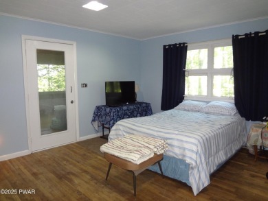 LARGE LAKE WALLENPAUPACK HOME WITH GOLF COURSE VIEWS IN on Paupack Hills Golf and Country Club in Pennsylvania - for sale on GolfHomes.com, golf home, golf lot