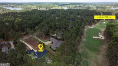 Indulge in opulent living within this custom 5-bedroom, 5.5-bath on Reynolds Lake Oconee - The Oconee in Georgia - for sale on GolfHomes.com, golf home, golf lot