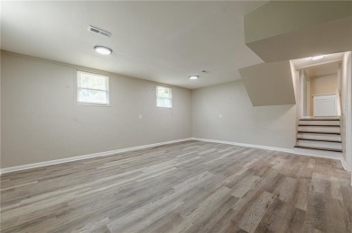 This home qualifies for up to $15,000 in grants--no income on Browns Mill Golf Course in Georgia - for sale on GolfHomes.com, golf home, golf lot