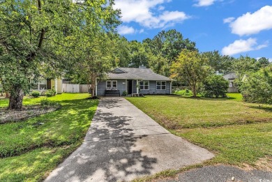 Discover your coastal haven in the tranquil Kings Grant on Indigo Creek Golf Club in South Carolina - for sale on GolfHomes.com, golf home, golf lot