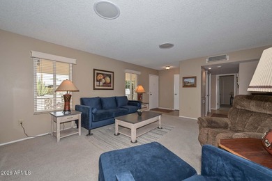 This charming 2 bedroom, 2 bath home has a bright living room on Sun City Lakes West and East in Arizona - for sale on GolfHomes.com, golf home, golf lot