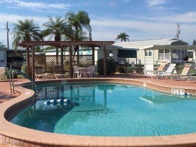 BEAUTIFUL HOME in Phase 3 of the much Desired Tamiami Villagee & on Six Lakes Country Club in Florida - for sale on GolfHomes.com, golf home, golf lot