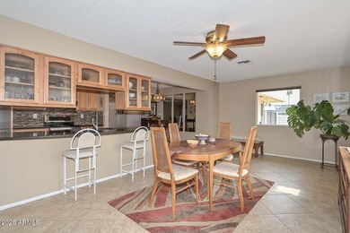 This charming 2 bedroom, 2 bath home has a bright living room on Sun City Lakes West and East in Arizona - for sale on GolfHomes.com, golf home, golf lot