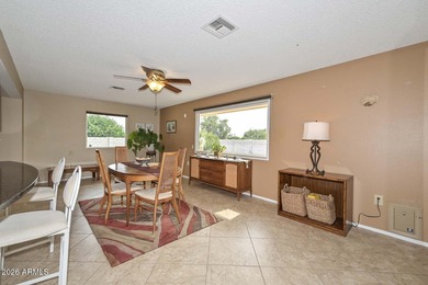 This charming 2 bedroom, 2 bath home has a bright living room on Sun City Lakes West and East in Arizona - for sale on GolfHomes.com, golf home, golf lot