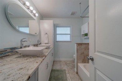 Under contract-accepting backup offers. Stunning Modern Pool on Clearwater Country Club in Florida - for sale on GolfHomes.com, golf home, golf lot