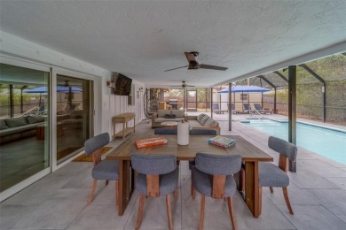 Under contract-accepting backup offers. Stunning Modern Pool on Clearwater Country Club in Florida - for sale on GolfHomes.com, golf home, golf lot