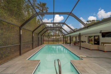 Under contract-accepting backup offers. Stunning Modern Pool on Clearwater Country Club in Florida - for sale on GolfHomes.com, golf home, golf lot
