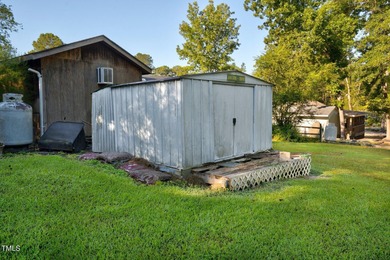 Escape to Lake Royale with this unique weekend retreat at 106 & on River Golf and Country Club at Lake Royale in North Carolina - for sale on GolfHomes.com, golf home, golf lot