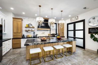 Enter through leaded glass double doors into an open concept on Mountain Vista Golf Course At Sun City Palm Desert in California - for sale on GolfHomes.com, golf home, golf lot