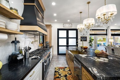 Enter through leaded glass double doors into an open concept on Mountain Vista Golf Course At Sun City Palm Desert in California - for sale on GolfHomes.com, golf home, golf lot