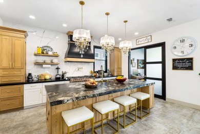 Enter through leaded glass double doors into an open concept on Mountain Vista Golf Course At Sun City Palm Desert in California - for sale on GolfHomes.com, golf home, golf lot