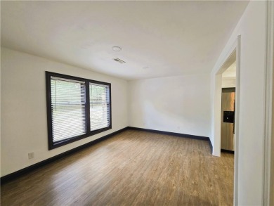 Nestled close to Dogwood Golf Course, this lovely end unit on Bella Vista Country Club and Golf Course in Arkansas - for sale on GolfHomes.com, golf home, golf lot