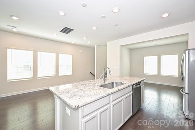 This elegant three story end-unit townhome located at City Park on Renaissance Park Golf Course in North Carolina - for sale on GolfHomes.com, golf home, golf lot