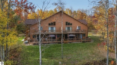 Vista Del Verde #4 is a peaceful corner condo that overlooks the on Schuss Mountain Golf Club in Michigan - for sale on GolfHomes.com, golf home, golf lot