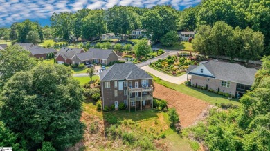 Welcome to 9 Belle Terre Court, where elegance meets tranquility on Summersett Golf Club in South Carolina - for sale on GolfHomes.com, golf home, golf lot