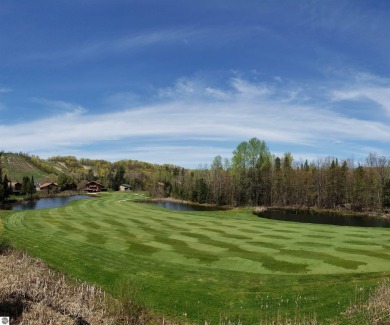 Vista Del Verde #4 is a peaceful corner condo that overlooks the on Schuss Mountain Golf Club in Michigan - for sale on GolfHomes.com, golf home, golf lot