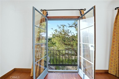 Discover a Mediterranean masterpiece in the heart of Alamitos on Recreation Park Golf Course 18 in California - for sale on GolfHomes.com, golf home, golf lot