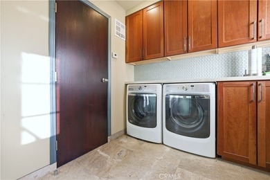 Discover a Mediterranean masterpiece in the heart of Alamitos on Recreation Park Golf Course 18 in California - for sale on GolfHomes.com, golf home, golf lot