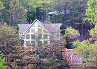 Soaring Wall of Windows feature Spectacular Views of Rumbling on Rumbling Bald Resort on Lake Lure in North Carolina - for sale on GolfHomes.com, golf home, golf lot