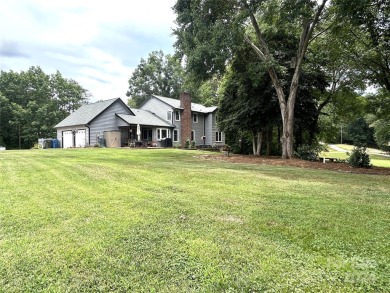 Explore this 4-bedroom, 3.5-bathroom home nestled alongside a on Catawba Springs Golf Course At Lake Hickory  in North Carolina - for sale on GolfHomes.com, golf home, golf lot