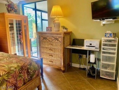 Inviting tropical oasis meets updated first floor convenience on The Landings Yacht, Golf and Tennis Club in Florida - for sale on GolfHomes.com, golf home, golf lot