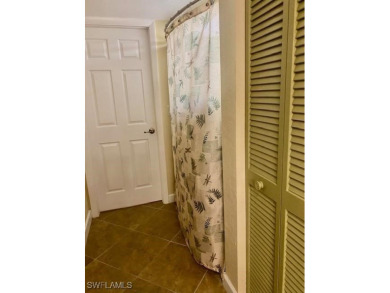 Inviting tropical oasis meets updated first floor convenience on The Landings Yacht, Golf and Tennis Club in Florida - for sale on GolfHomes.com, golf home, golf lot