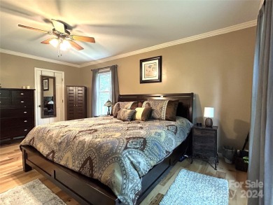 Explore this 4-bedroom, 3.5-bathroom home nestled alongside a on Catawba Springs Golf Course At Lake Hickory  in North Carolina - for sale on GolfHomes.com, golf home, golf lot