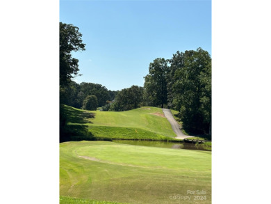 Explore this 4-bedroom, 3.5-bathroom home nestled alongside a on Catawba Springs Golf Course At Lake Hickory  in North Carolina - for sale on GolfHomes.com, golf home, golf lot