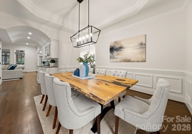 Set on a level one-acre lot on the 5th hole of Trump National on Trump National Golf Club Charlotte in North Carolina - for sale on GolfHomes.com, golf home, golf lot