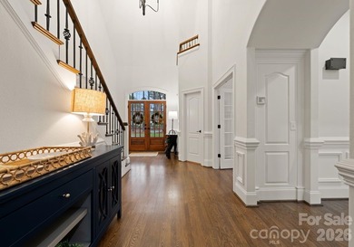 Set on a level one-acre lot on the 5th hole of Trump National on Trump National Golf Club Charlotte in North Carolina - for sale on GolfHomes.com, golf home, golf lot