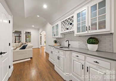 Set on a level one-acre lot on the 5th hole of Trump National on Trump National Golf Club Charlotte in North Carolina - for sale on GolfHomes.com, golf home, golf lot