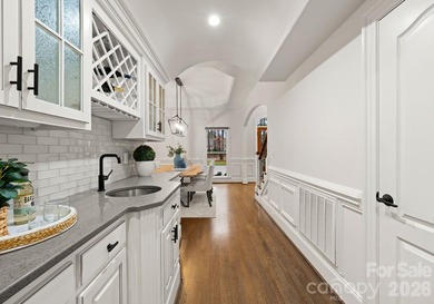 Set on a level one-acre lot on the 5th hole of Trump National on Trump National Golf Club Charlotte in North Carolina - for sale on GolfHomes.com, golf home, golf lot