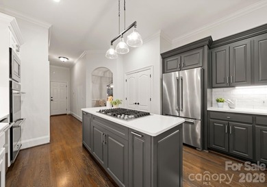 Set on a level one-acre lot on the 5th hole of Trump National on Trump National Golf Club Charlotte in North Carolina - for sale on GolfHomes.com, golf home, golf lot